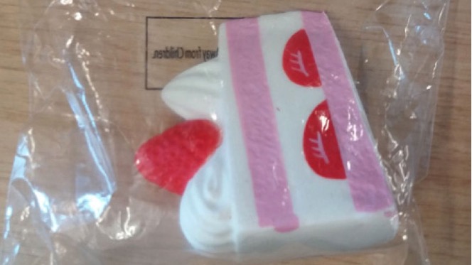 “Squish it, squash it, squeeze it!” reads the label on the Slow Rising Scented Squishy, which is shaped like a slice of cake and might be confused for food, causing children to choke on its parts, the EC warns. (Screengrab via European Commission)
