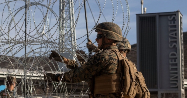 Department of Defence personnel install barriers requested by Custom and Border Protection at the San Ysidro port of entry, San Diego, US, under the Operation Secure Line anticipating the arrival of Central American migrants heading towards the border, as seen from the Mexican side of the border in Tijuana, Mexico on Nov. 13, 2018. (Guillermo Arias/AFP/Getty Images)