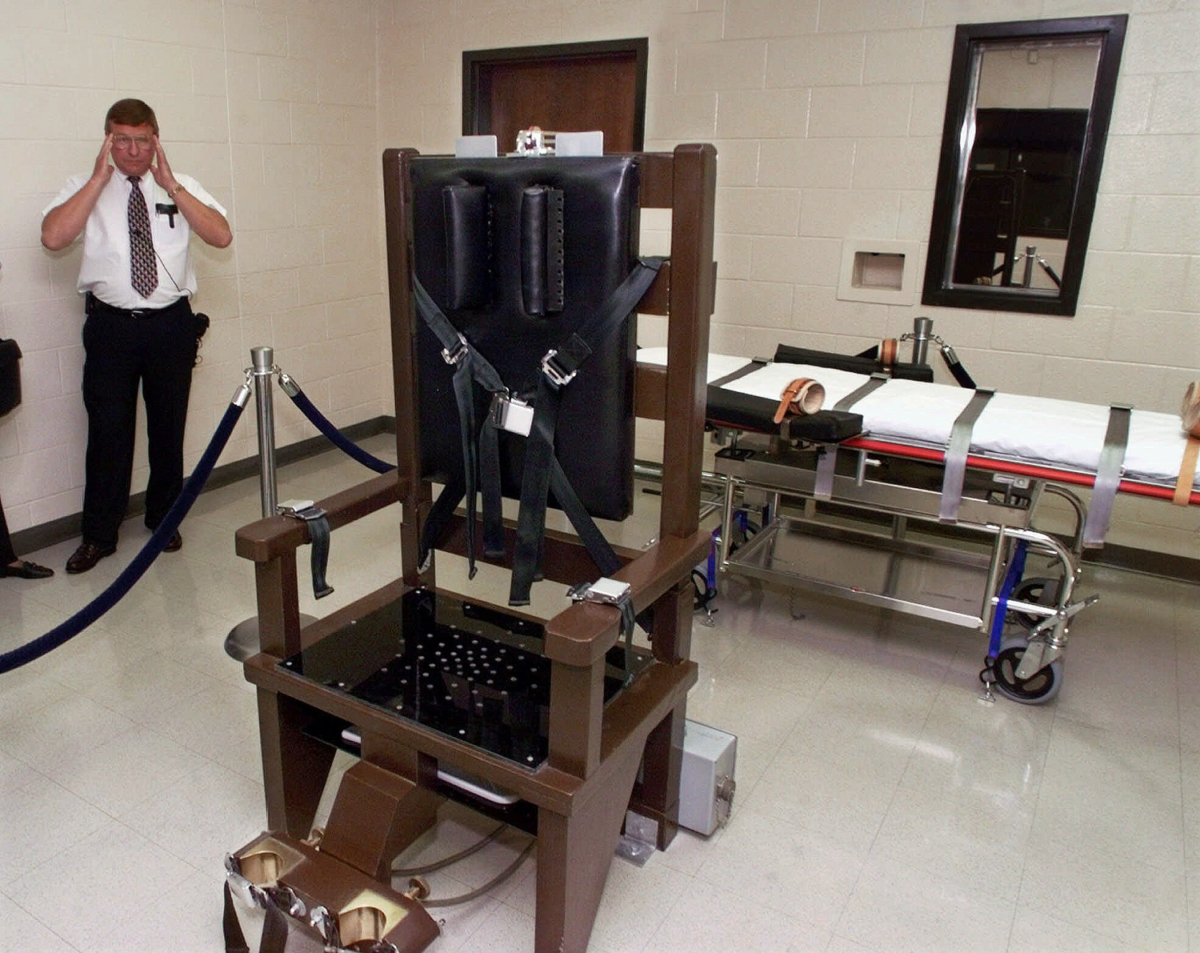 File photo showing Ricky Bell, the warden at Riverbend Maximum Security Institution in Nashville, Tenn., as he gives a tour of the prison's execution chamber, on Oct. 13, 1999. (AP Photo/Mark Humphrey, File)