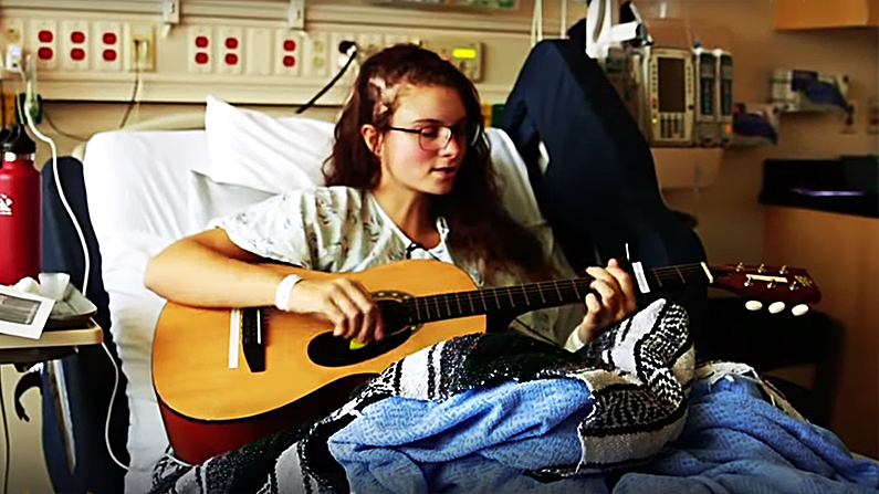 Kira was back to making music just two days after her surgery. (Screenshot/Seattle Children's Hospital via Storyful)