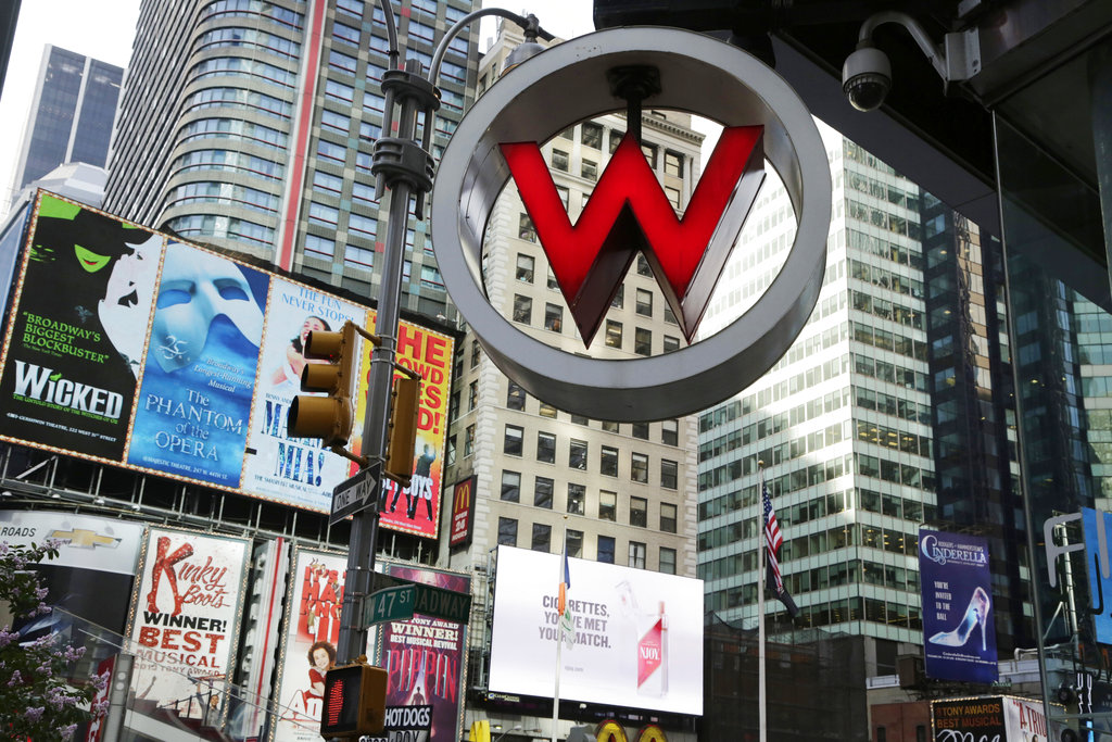 The logo for the W Hotel, owned by Starwood Hotels & Resorts Worldwide, is seen in New York's Times Square, on July 31, 2013. (AP Photo/Mark Lennihan, File)