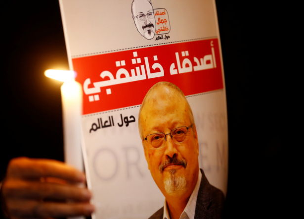 A demonstrator holds a poster with a picture of Saudi journalist Jamal Khashoggi