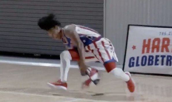Torch George supported herself on one hand while dribbling a basketball with the other hand, between her legs. on Nov. 8. (Screenshot/Reuters)