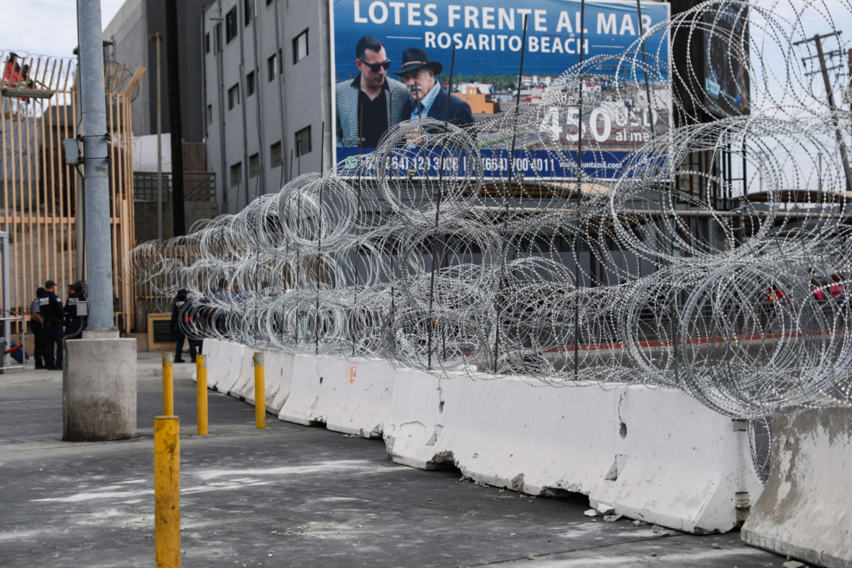 Several vehicle lanes adjacent to a pedestrian entrance remain closed at the San Ysidro port of entry on the U.S.-Mexico border. The crossing area was fortified by the U.S. Department of Defense early in the morning of Nov. 19, 2018. (Charlotte Cuthbertson/The Epoch Times)