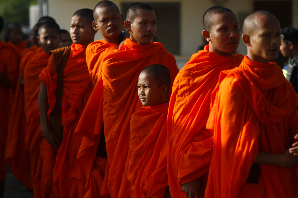 Cambodian Buddhist monks wait in queue to enter into the courtroom before the hearings against two former Khmer Rouge senior leaders, at the U.N.-backed war crimes tribunal on the outskirts of Phnom Penh, Cambodia, on Nov. 16, 2018. (AP Photo/Heng Sinith)