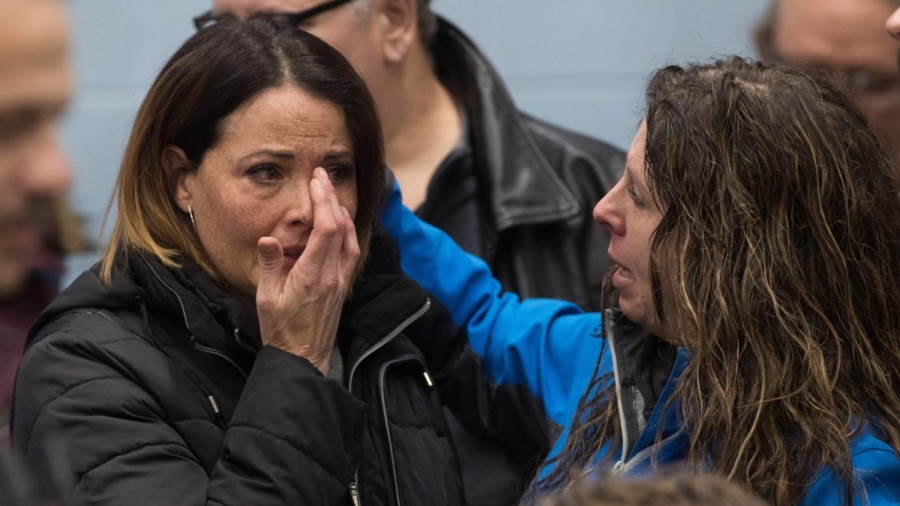 Emotional General Motors Workers Seen Wiping Away Tears After Company Lays Off 14,500 People