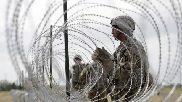 soldiers are installing wires on the border