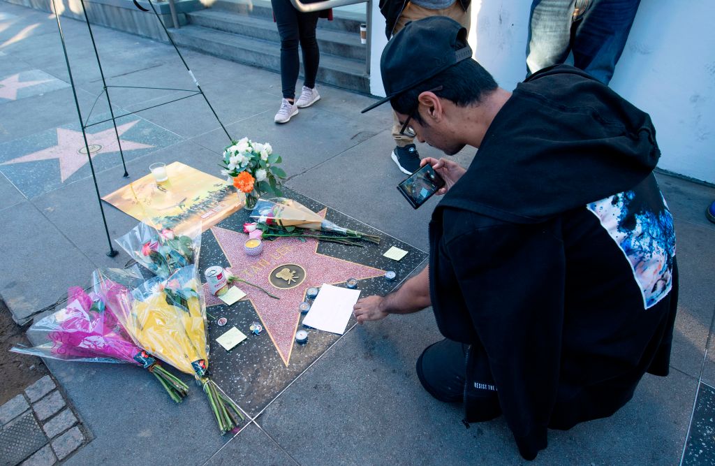 Fans leave tributes on Stan Lee's star on the Hollywood Walk of Fame shortly after the news that the Marvel founder died aged 95 was made public, in Hollywood, Calif., on Nov. 12, 2018. (Valerie Macon/AFP/Getty Images)