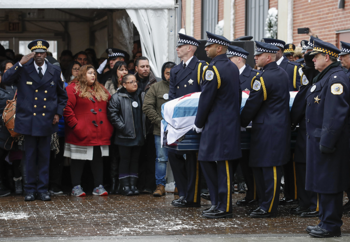 An honor guard carries the casket of slain Chicago Police Officer Samuel Jimenez to the hearse following funeral services at the Chapel of St Joseph at Shrine of Our Lady of Guadalupe in Des Plaines, Illinois, on Nov. 26, 2018. (Kamil Krzaczynski/Getty Images)