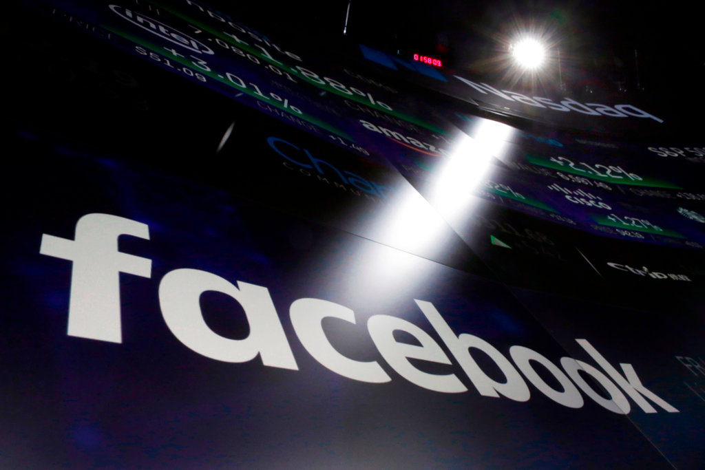 The Facebook logo appears on screens at the Nasdaq MarketSite in New York's Times Square on March 29, 2018. (Richard Drew/AP Photo/File)