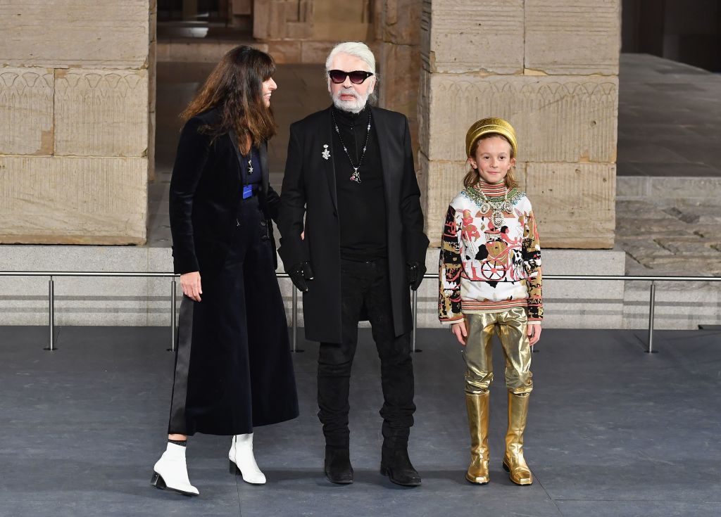 German designer Karl Lagerfeld (C) walks the runway 