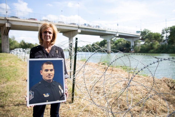 Mary Ann Mendoza, whose son Sgt Brandon Mendoza was killed by an illegal immigrant, stands next to the Rio Grande.