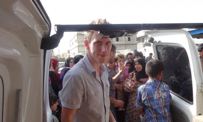 Peter Kassig delivering supplies for Syrian refugees. (AP Photo/Courtesy of Kassig Family)