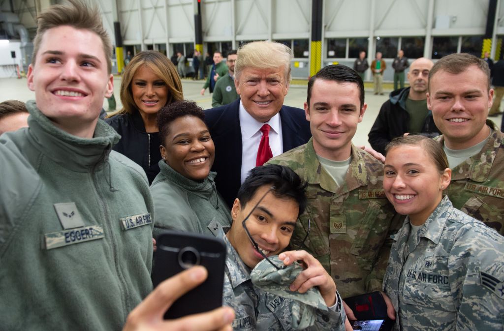 Trump and melania with troops