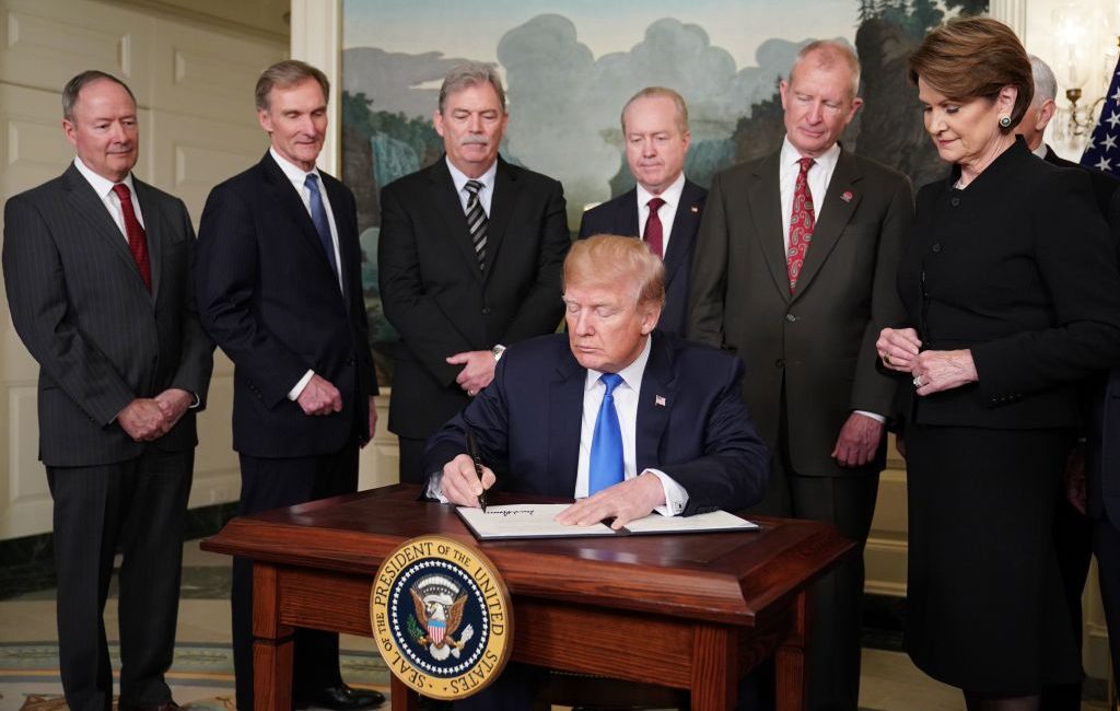 President Donald Trump signs trade sanctions against China in the Diplomatic Reception Room of the White House, on March 22, 2018. (Mandel Ngan/AFP/Getty Images)
