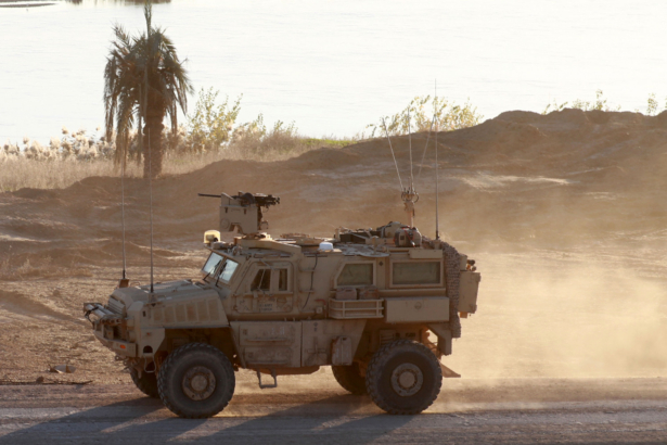 A U.S. army vehicle supporting Syrian Democratic Forces (SDF) in Hajin, Deir Ezzor Province, eastern Syria, on Dec. 15, 2018. Kurdish-led forces seized ISIS's main hub from Hajin on Dec. 14, 2018. (Delil Souleiman/AFP/Getty Images)