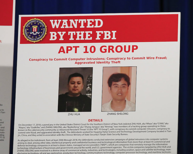 A poster displayed during a news conference at the Department of Justice in Washington, Dec. 20, 2018. (AP/Manuel Balce Ceneta)