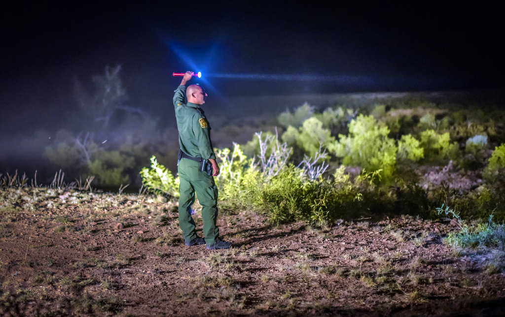 Border Patrol agents wait for other units in the Animas Valley in New Mexico's boot heel area on June 23, 2015. (Roberto E. Rosales/The Albuquerque Journal via AP, File)