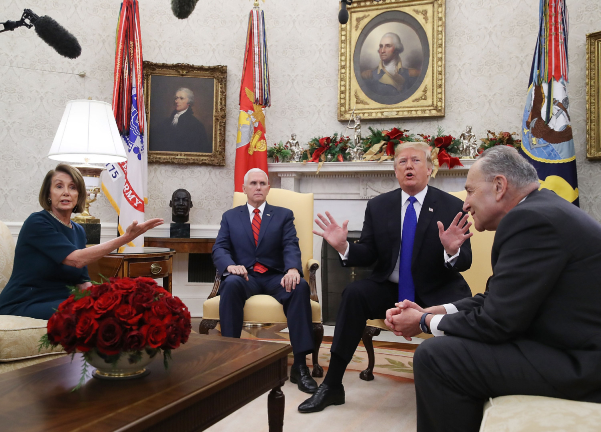 President Donald Trump (2R) argues about border security with Senate Minority Leader Chuck Schumer (D-NY) (R) and House Minority Leader Nancy Pelosi (D-CA) as Vice President Mike Pence sits nearby in the Oval Office in Washington, on Dec. 11, 2018. (Mark Wilson/Getty Images)