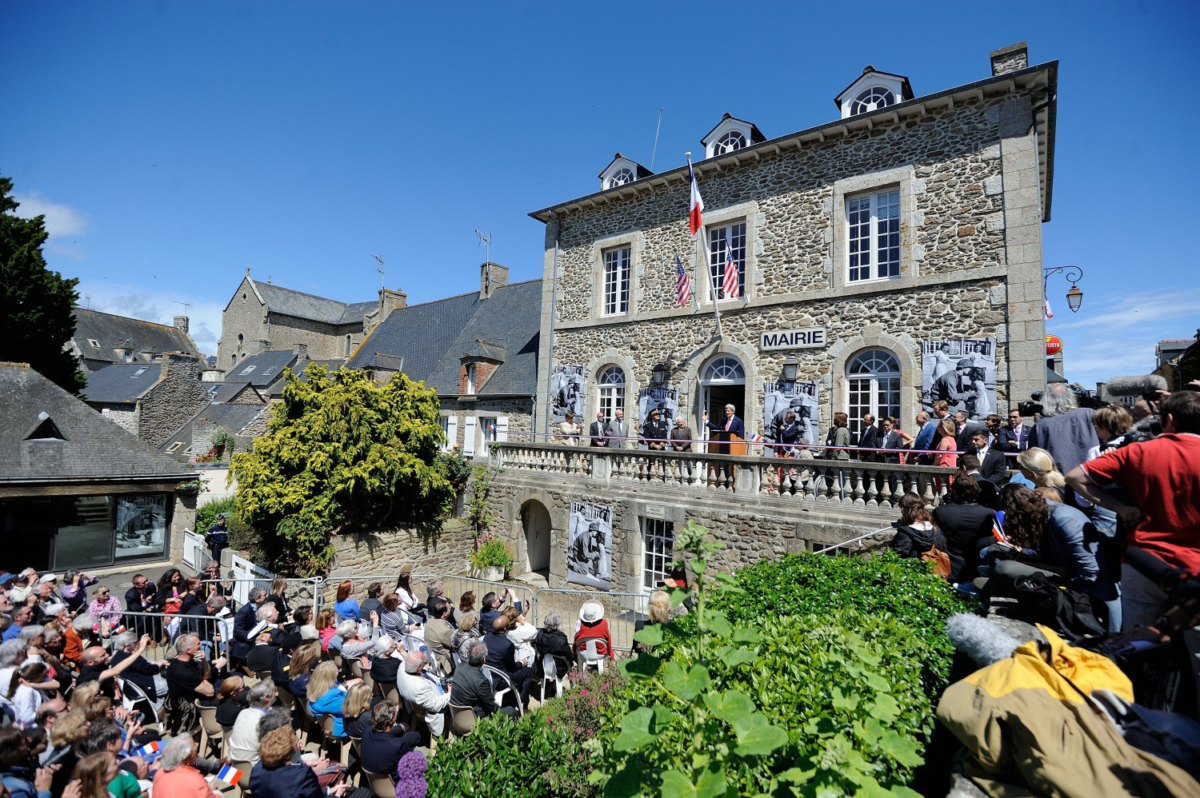 John Kerry delivers a speech during the inauguration of the Tony Vaccaro Square, in front of city hall of Saint-Briac-sur-Mer, western France, on June 7, 2014. (Jean-Sebastien Evrard/AFP/Getty Images)