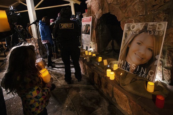 Community members hold a candlelight vigil for Kelsey Berreth under the gazebo of Memorial Park in Woodland Park, Colo., on Thursday, Dec. 13, 2018. (Kelsey Brunner/The Gazette via AP)