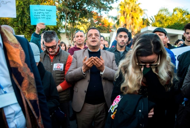A man prays as Moroccans pay tribute to murdered Danish Louisa Vesterager Jespersen and Norwegian Maren Ueland in Rabat on Dec. 22, 2018. (FADEL SENNA/AFP/Getty Images)