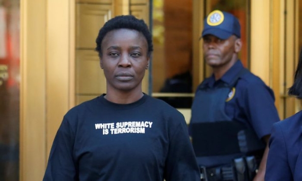 Patricia Okoumou walks out of federal court from her arraignment, a day after authorities say she scaled the stone pedestal of the Statue of Liberty, in Manhattan, New York, on July 5, 2018. (Shannon Stapleton/Reuters)