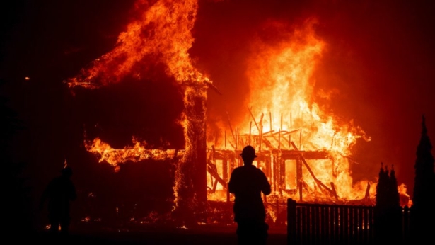 A home burns as the Camp Fire rages through Paradise, Calif., on Nov. 8, 2018. (Noah Berger/AP Photo)