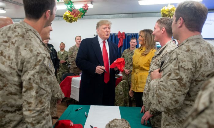 trump signing troops hat