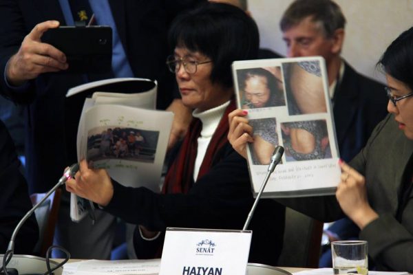 Special guest Ms. Yumei Liu (center), who presented the torture methods which was exposed in labor camps in China. (Lukáš Kruťa/The Epoch Times)