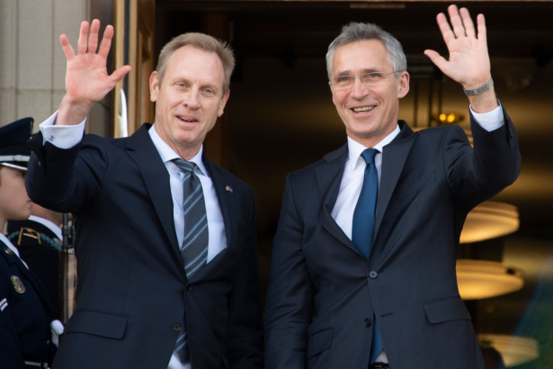 Acting Secretary of Defense Patrick Shanahan (L) waves as NATO Secretary General Jens Stoltenberg (R) arrives at the Pentagon in Washington on Jan. 28, 2019. (Jim Watson/AFP/Getty Images)