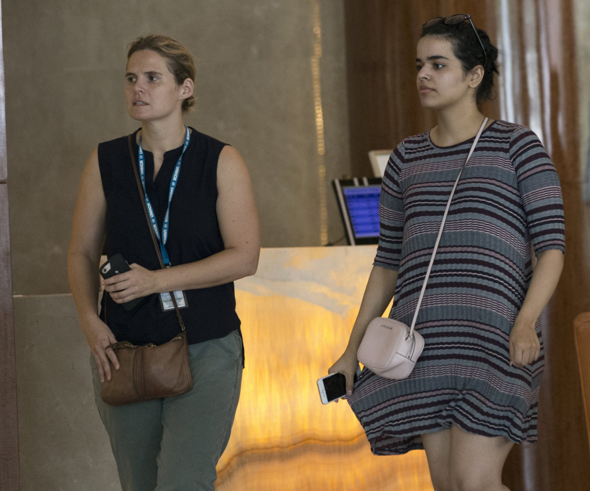 Rahaf Mohammed Alqunun, right, walks with an unidentified companion in Bangkok, Thailand, on Jan. 11, 2019. (Sakchai Lalit/AP)