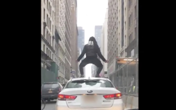Crazed Cyclist Leaps on Uber Roof in Mid-town Manhattan, Attacks Driver With Lock