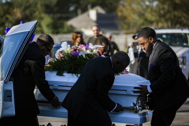 The casket of Jazmine Barnes is removed from the funeral hearse to be taken inside the Community of Faith Church for a memorial service, Jan. 8, 2019, in Houston. (Marie De Jesus/Houston Chronicle/AP)
