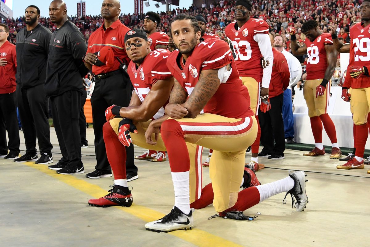 Colin Kaepernick #7 and Eric Reid #35 of the San Francisco 49ers kneel in protest during the national anthem prior to playing the Los Angeles Rams in their NFL game at Levi's Stadium, Santa Clara, Calif., Sept. 12, 2016. (Thearon W. Henderson/Getty Images)