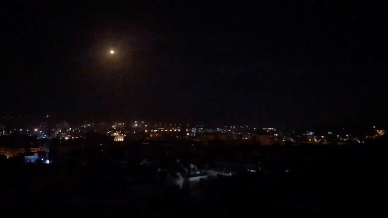 What is believed to be guided missiles are seen in the sky during what is reported to be an attack in Damascus, Syria, January 21, 2019, in this still image taken from a video obtained from social media. (Facebook Diary of a Mortar Shell in Damascus/Youmiyat Qadifat Hawun fi Damashq/via Reuters)