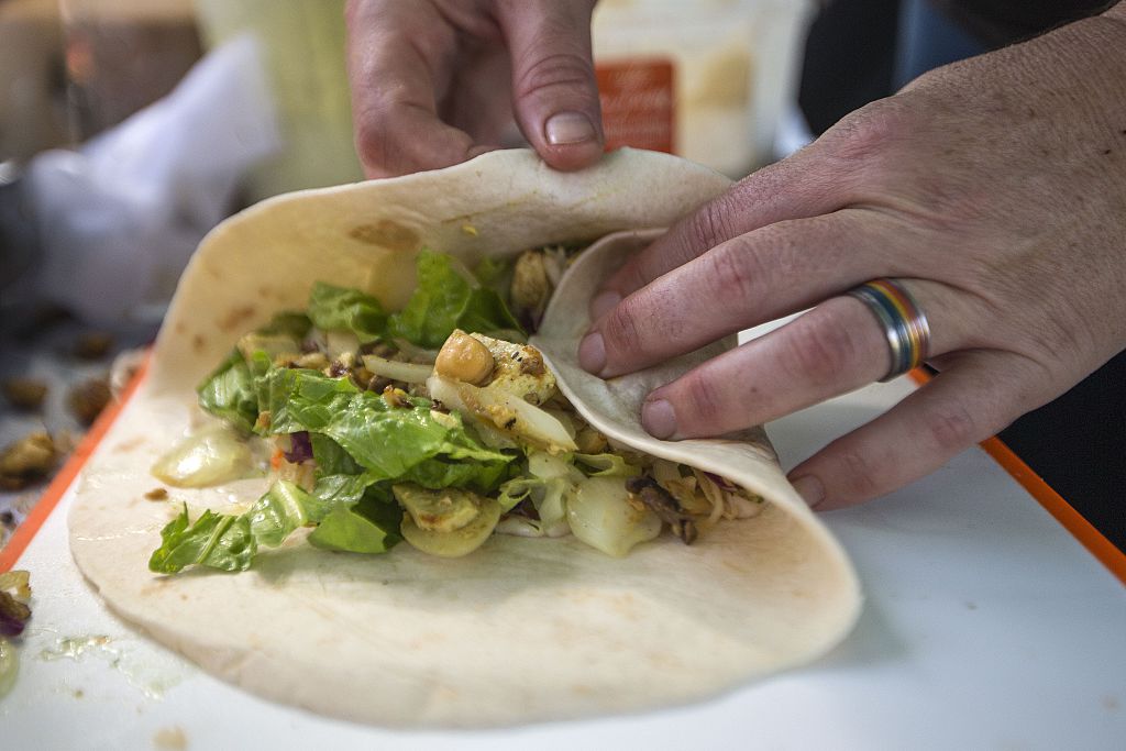 A cook prepares vegan tacos on October 13, 2014 during the "Vegan Fest" fair in the Israeli city of Ramat Gan near Tel Aviv. (Jack Guez/AFP/Getty Images)