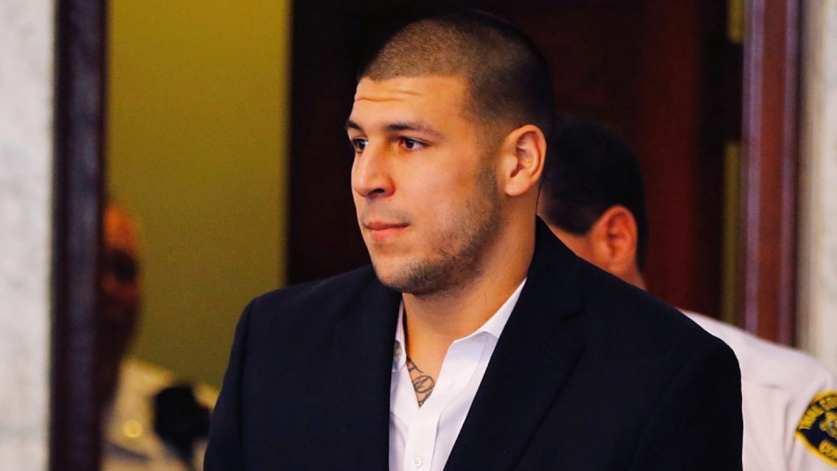 Aaron Hernandez is escorted into the courtroom of the Attleboro District Court for his hearing in North Attleboro, Mass., on Aug. 22, 2013. (Jared Wickerham/Getty Images)