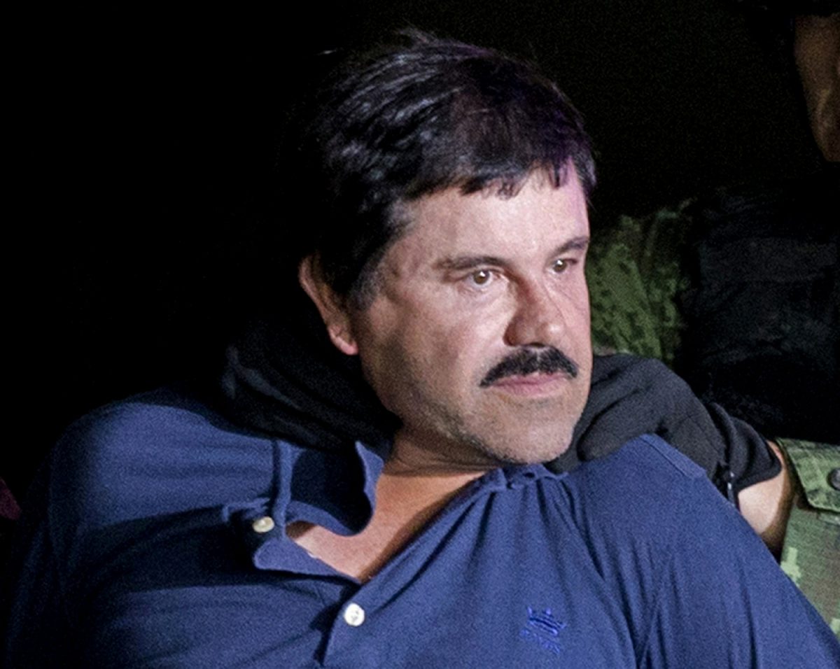 Drug lord Joaquin "El Chapo" Guzman is made to face the media in Mexico City as he is escorted by Mexican soldiers following his recapture six months after escaping from a maximum security prison, on Jan. 8, 2016. (Eduardo Verdugo/AP Photo)