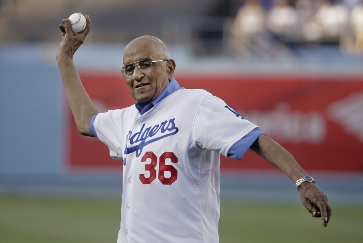 Former Los Angeles Dodgers pitcher Don Newcombe throws a ceremonial pitch before a baseball game between the Los Angeles Dodgers and the Cleveland Indians, in L.A., on July 1, 2014. (Chris Carlson/AP)