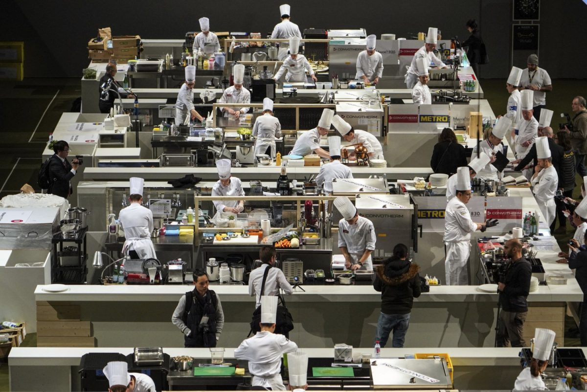 Chefs prepare food during the final of the "Bocuse d'Or" (Golden Bocuse) trophy, in Lyon, central France, on Jan. 30, 2019. (AP Photo/Laurent Cipriani)