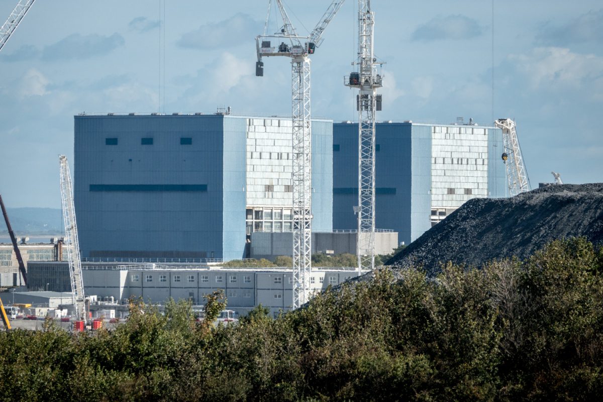 Tower cranes are pictured in front of the Hinkley A buildings at the construction site of the Hinkley Point C nuclear power station being built near Bridgwater, on Oct. 1, 2018, in Somerset, England. (Matt Cardy/Getty Images)