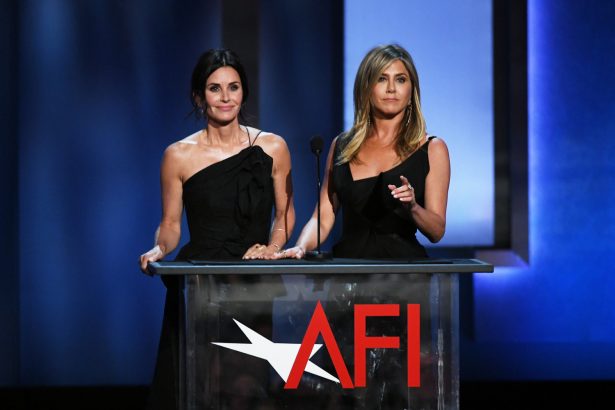Courteney Cox (L) and Jennifer Aniston speak onstage during the American Film Institute's 46th Life Achievement Award Gala Tribute to George Clooney at Dolby Theatre in Hollywood, Cali., on June 7, 2018. (Kevin Winter/Getty Images)