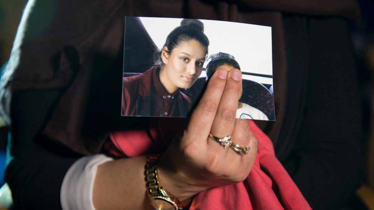 Renu, the eldest sister of Shamima Begum, holds her sister’s photo during a media interview at New Scotland Yard in London, on Feb. 22, 2015. (Laura Lean/PA Wire/Getty Images)