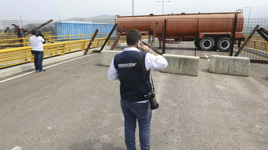 Venezuela Military Barricades Key Bridge to Stop Aid and Food