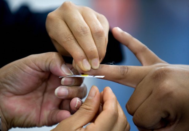 File photo showing a nurse taking a blood sample to establish the level of cholesterol of a visitor during the World Summit against Obesity, in Mexico City, on Aug. 20, 2009. (Luis Acosta/AFP/Getty Images)
