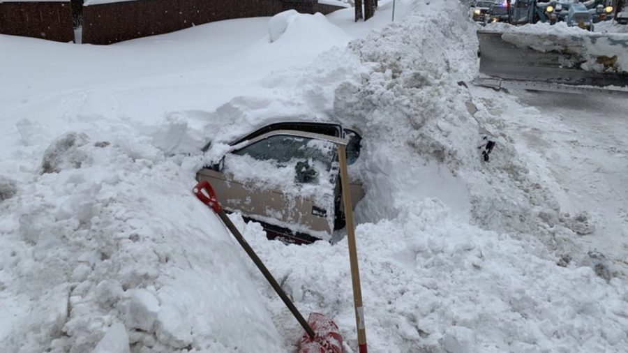 Snowplow Bumps Into Snow-Covered Car, Finds Woman OK Inside
