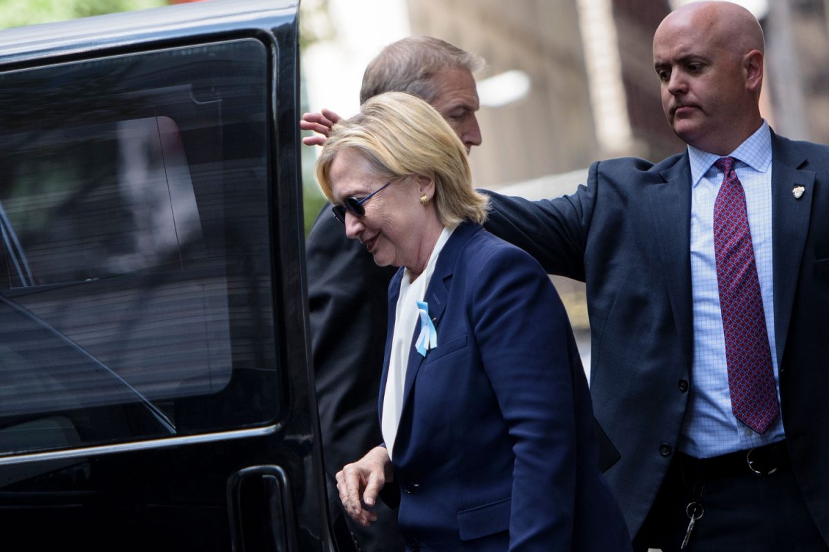 Then-Democratic presidential nominee Hillary Clinton gets in her car while leaving her daughter's apartment building in New York City on Sept. 11, 2016. (BRENDAN SMIALOWSKI/AFP/Getty Images)