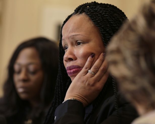 Rochelle Washington, left, and attorney Gloria Allred, right, look on Latresa Scaff speaks during a news conference in New York on Feb. 21, 2019. Scaff and Washington are accusing musician R. Kelly of sexual misconduct on the night they attended his concert when they were teenagers. (AP Photo/Seth Wenig)