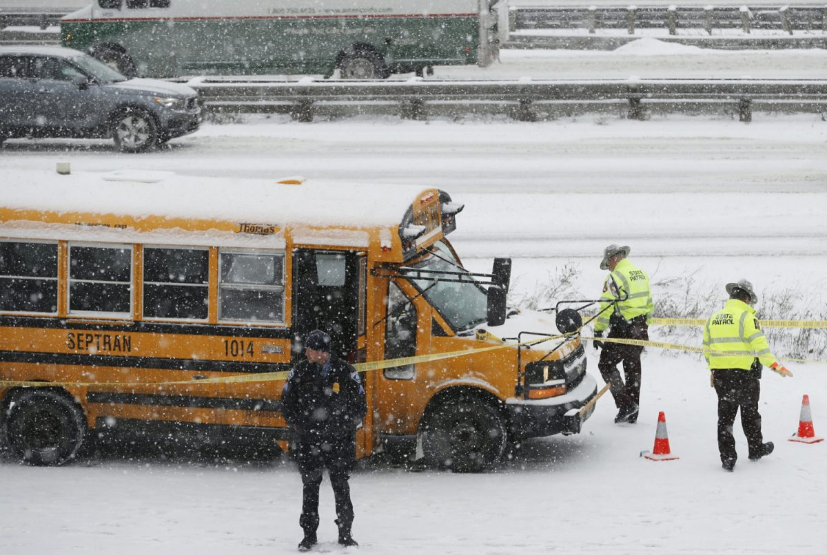 A person of interest was taken into custody after a school bus driver was shot where Interstate 35W and 94 run together near downtown Minneapolis, on Feb. 5, 2019. (Richard Tsong-Taatarii/Star Tribune via AP)